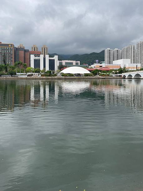 Performance venue with white dome cover by the river in a cloudy day