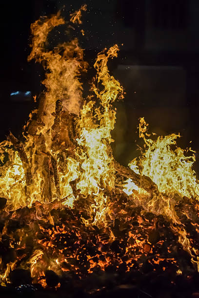 istock Fire flames on black background, Blaze fire flame texture background, Beautifully, the fire is burning, Fire flames with wood and cow dung bonfire 2223346691