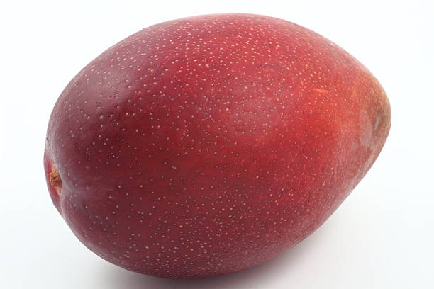 Mango fruits with yellow background.