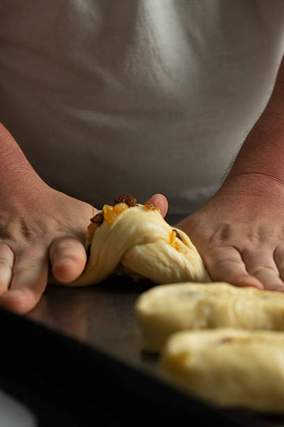 Baker making a preparation with dough for bread and cakes