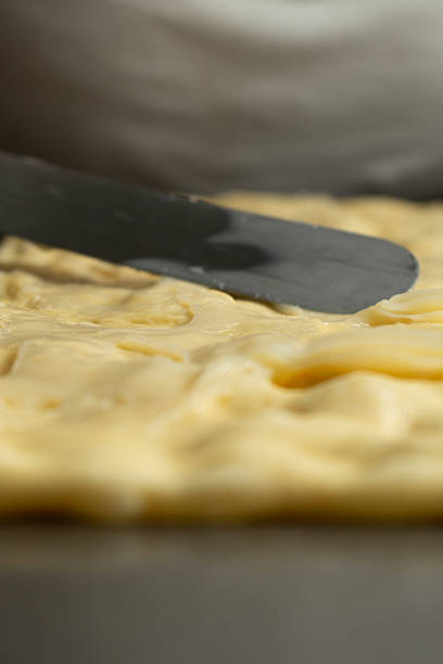 istock Baker making a preparation with dough for bread and cakes 2223350042