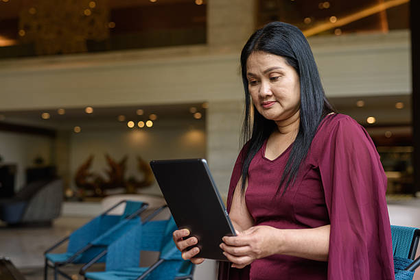istock Portrait of stylish woman sitting in cafe restaurant using digital tablet computer 2223351299