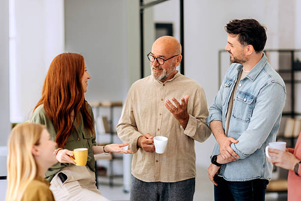 istock Three colleagues having coffee break at the office 2223352129