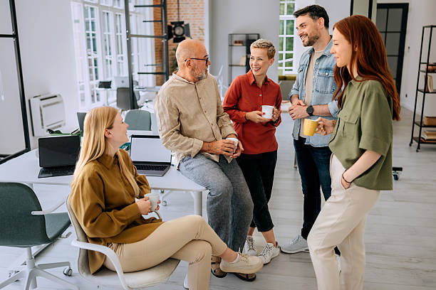 istock Group of colleagues having coffee break at the office 2223352374
