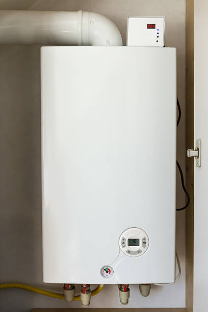 istock Installed household gas boiler hanging on the wall 2223352401