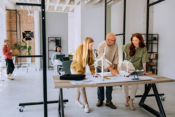 istock Three colleagues working on turbine model project in office 2223352496