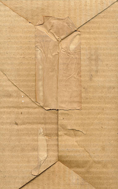 istock Brown cardboard textured box. Old dirty cardboard surface background. Vintage 2223353325