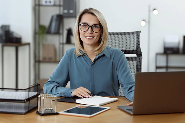 istock Businesswoman working on laptop at table in office 2223355073
