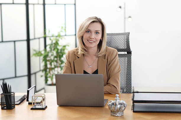 istock Businesswoman working on laptop at table in office 2223355230