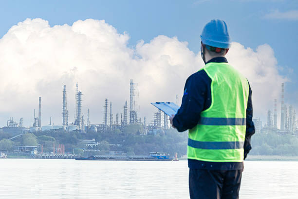 istock Engineer working with clipboard outside chemical plant 2223358301