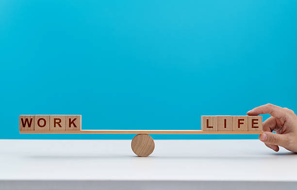 istock Wooden seesaw with word life and work 2223358372