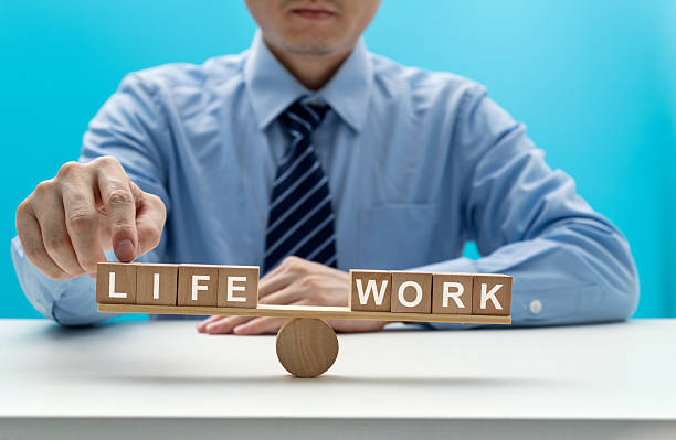 istock Wooden seesaw with word life and work 2223358513