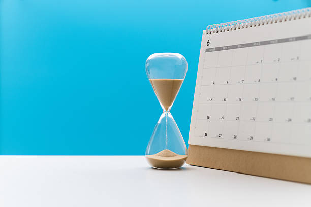 istock Calendar and hourglass on the table 2223358570