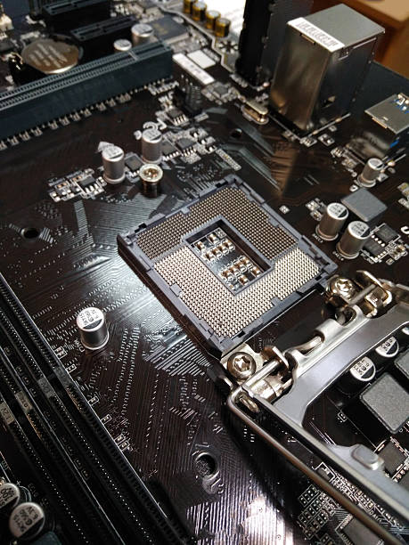 istock Close-up of an empty CPU socket on a computer motherboard, showing fine metal contacts, components, and locking mechanism, tech or electronics themes 2223360197