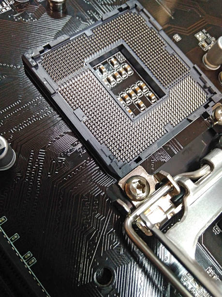 istock Close-up of an empty CPU socket on a computer motherboard, showing fine metal contacts, components, and locking mechanism, tech or electronics themes. 2223360202