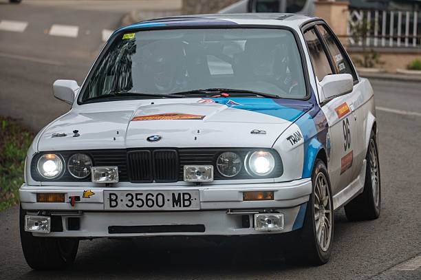 Sant Hilari Sacalm, Spain – March 15, 2025: BMW 323i E30 rally car in action during the 73 KH7 Costa Brava Rally, part of the Spanish Historic Rally Championship.