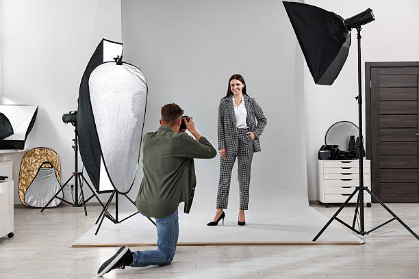 istock Photographer working with model in professional photo studio 2223362038