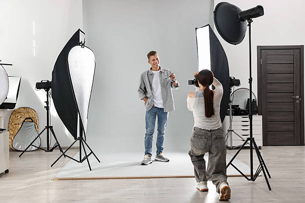 istock Photographer working with model in professional photo studio 2223362155