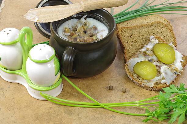 slice of bread with lard on stone background