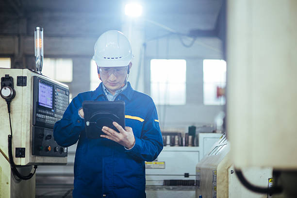 istock Asian male engineer working with digital tablet in factory 2223363311