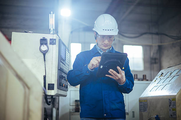 istock Asian male engineer working with digital tablet in factory 2223363325