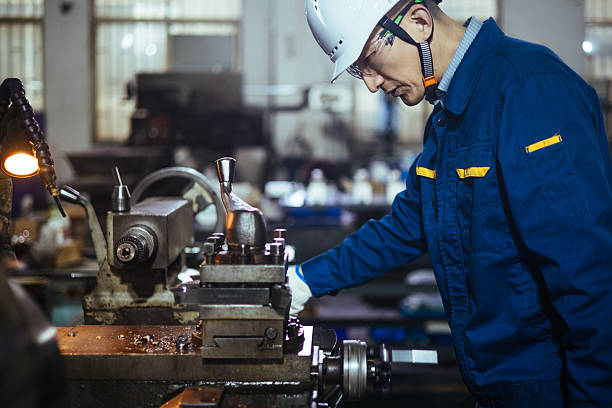 istock Asian male engineer working on lathe 2223363378