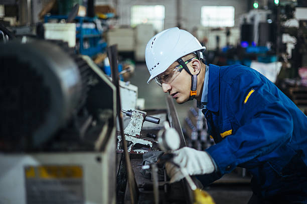 istock Asian male engineer working on lathe 2223363429