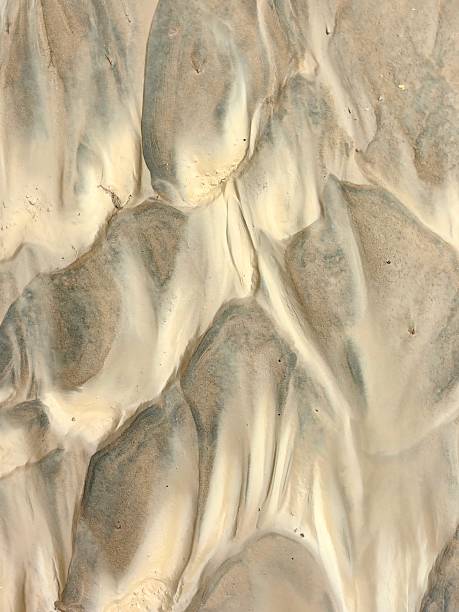 istock unique patterns sand and clay create textured landscape in natural setting. closeup. 2223367898