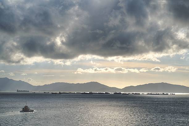istock Serene Seascape with Boats and Mountains 2223370142