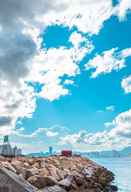 istock Scenic Rocky Shoreline with City Skyline 2223370260