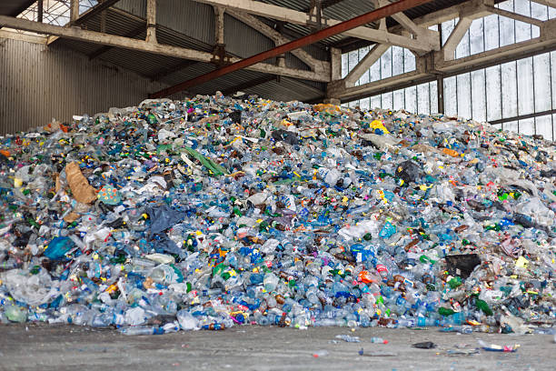 istock Massive Pile of Plastic Waste in Industrial Warehouse 2223370466