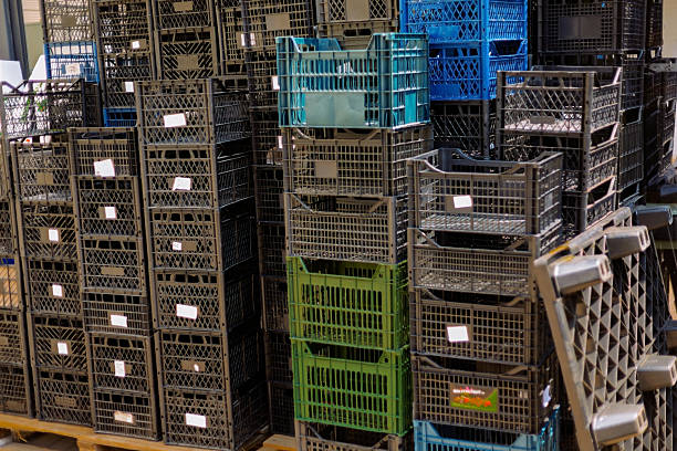 Indian fish export containers tower isolated on black.