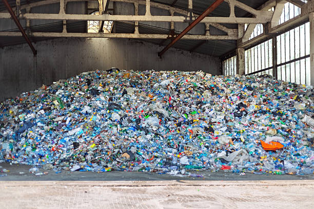 istock Huge pile of plastic garbage polluting a warehouse 2223370526
