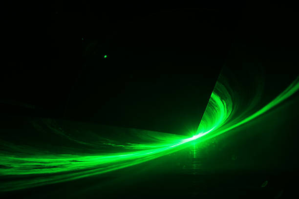 Green laser in black background