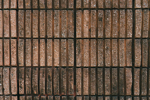 Textured Brick Wall Surface with Distinct Lines and Warm Earthy Tones Ideal for Background or Architectural Design.