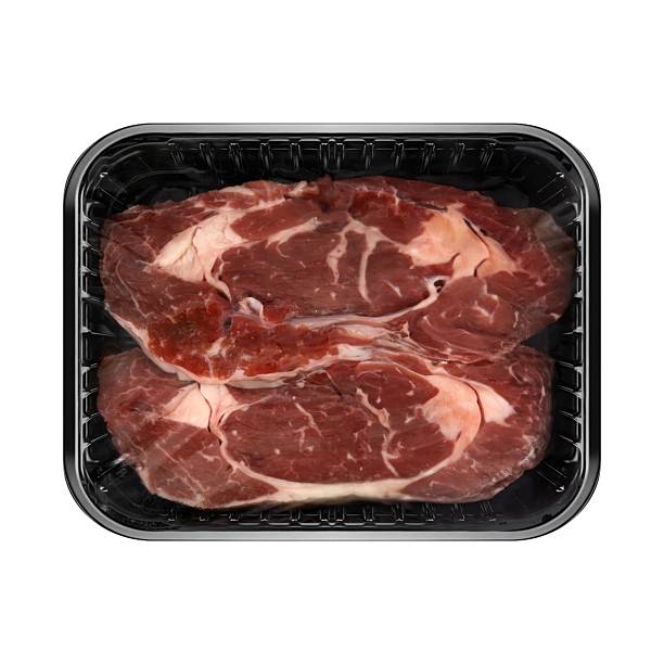 istock Packaged raw beef steaks in a black tray. 2223377809