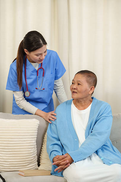 istock Physiotherapist speaks with elderly patient, offering kind words and gentle reassurance while observing the patient's comfort and well-being during recovery. 2223378983