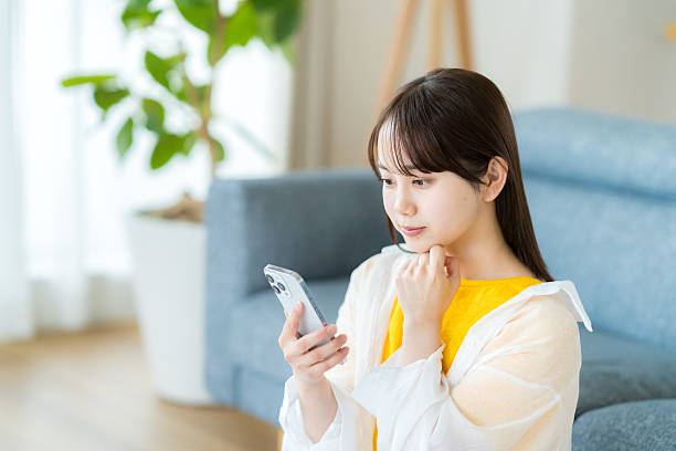 istock young woman calling on smartphone 2223382663