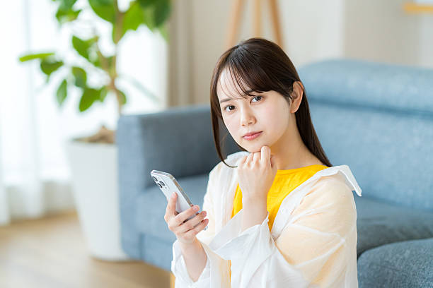 istock young woman calling on smartphone 2223382735