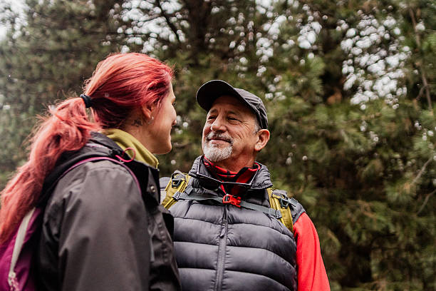 istock Father and daughter talking during hiking at forest 2223384740