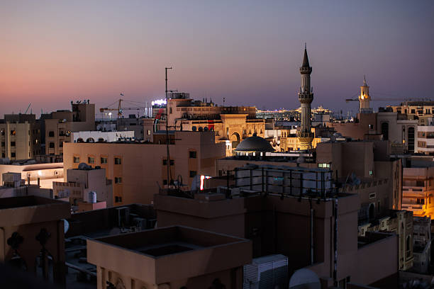 Traditional Arab houses and the towering minaret of the mosque in the neighborhood of Bur Dubai Creek.