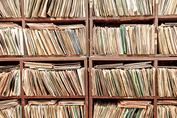 istock Shelves filled with organized paper files representing storage and historical documentation 2223392584