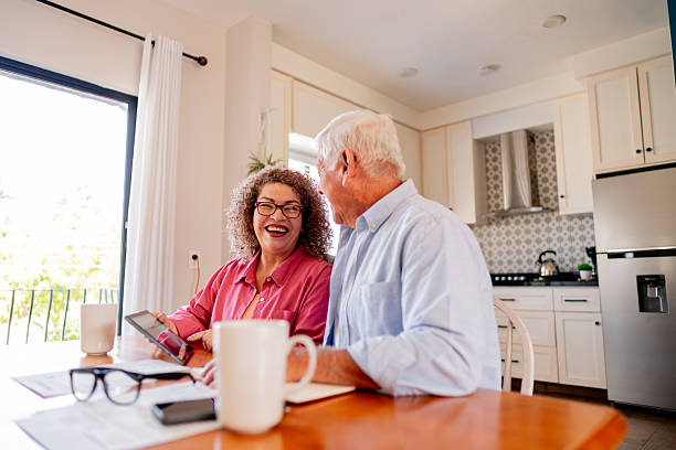 istock Senior couple talking and doing home finance 2223393875