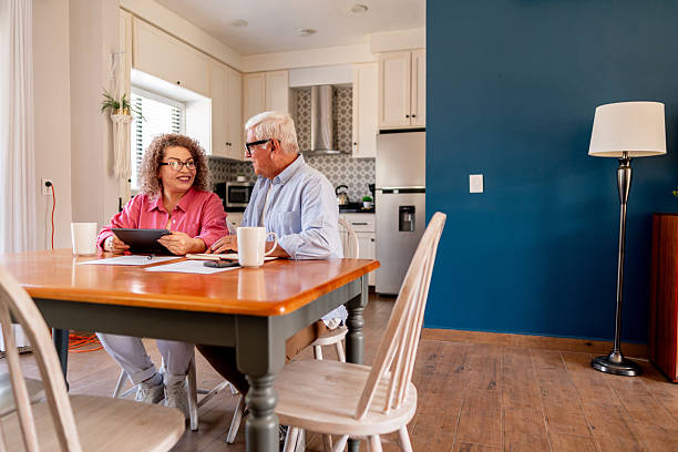 istock Senior couple talking and doing home finance 2223393881