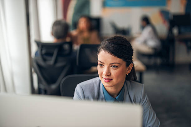istock Businesswoman in Modern Office Focused on Technology and Work Dynamics 2223394766