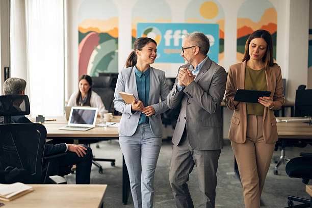 istock Business Team Collaborating in Modern Office Environment with Positive Interaction 2223395022