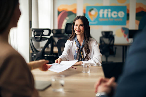 istock Professional Woman Interacting During Business Meeting in Modern Office Setting 2223395027