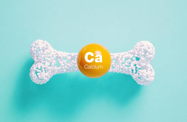 istock Ca (Calcium) Written Orange Molecule Over White Bone On Blue Background - Healthy Lifestyle Concept 2223401887