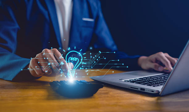 istock Hand of  holding illuminated light bulb, Idea innovation and inspiration concept.  creativity with bulbs that shine glitter, Concept for success. 2223402176
