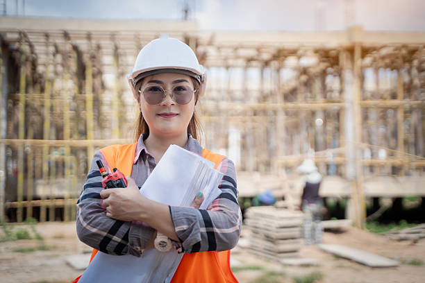 istock Portrait of a female engineer holding blueprints in a construction site 2223405371